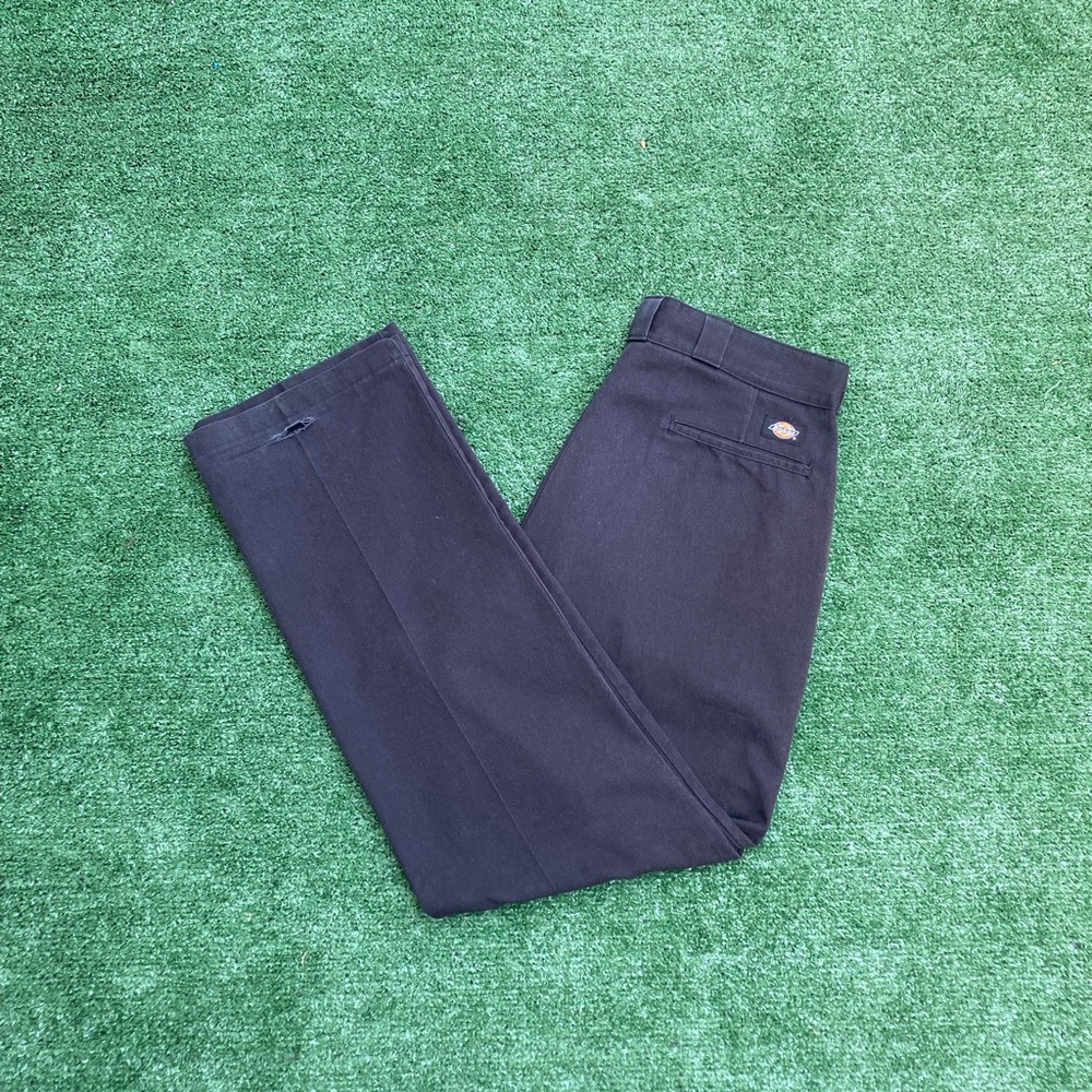Brown dickies with a baggy fit with a hole